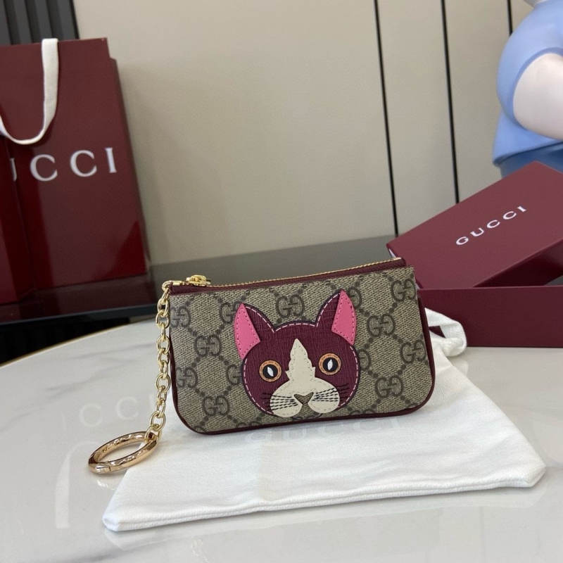 G*u*i clutch bags